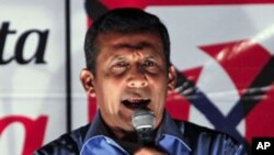 Presidential candidate Ollanta Humala speaks to supporters for the first time since exit polls and partial vote count gave him a victory in the first round of elections in Peru, April 10, 2011.