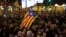 FILE - Demonstrators march during a protest after Spain's cabinet meeting in Barcelona, Spain, Dec. 21, 2018.