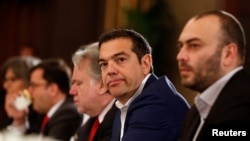 Greek Prime Minister Alexis Tsipras (2nd-R) attends a trilateral summit with Cypriot President Nicos Anastasiades and Jordan's King Abdullah to expand cooperation in the East Mediterranean region, in Amman, Jordan, April 14, 2019.