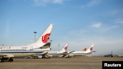 FILE - Air China airplanes are seen at Beijing Capital International Airport, in Beijing, China, June 16, 2020. 