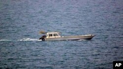 A photo provided by the U.S. Navy shows a small vessel that was fired upon by the U.S. Navy off Dubai's coast on Monday, July 16, 2012. 