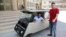 Khaled Bardawil and Jamal al-Meqati pose with their solar-powered car. (Courtesy: Gaza Al-Azhar University)