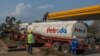 FILE - A tanker offloads fuel at Petroda Filling Station in the capital Lilongwe, Malawi, October 1, 2021.