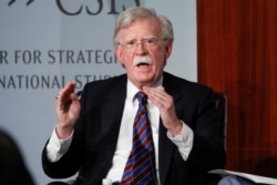 FILE - In this Sept. 30, 2019, photo, former national security adviser John Bolton gestures while speakings at the Center for Strategic and International Studies in Washington.