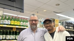 Richard Harris, General Manager of Calvert Woodley, a liquor store in Washington, DC, with Xavier Scott, cheese specialist. Photo by Natalie Liu