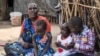 Shejirina Moni gave birth to nine children but only three of them, two girls and a boy, are alive. Six died of various illnesses. (Chika Oduah/VOA)