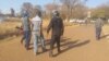 Police arresting some political activists. (Courtesy photo: Zimbabwe Lawyers for Human Rights)