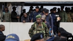 Former members of the Armed Forces of the Democratic Republic of Congo and police officers who allegedly surrendered to M23 rebels arrive in Goma, Congo, Feb. 23, 2025. President Felix Tshisekedi said he is going to launch a unity government.