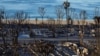 The charred remains of a trailer park are seen along a beach, following the Palisades Fire, at the Pacific Palisades neighborhood in Los Angeles, California, Jan. 15, 2025. 