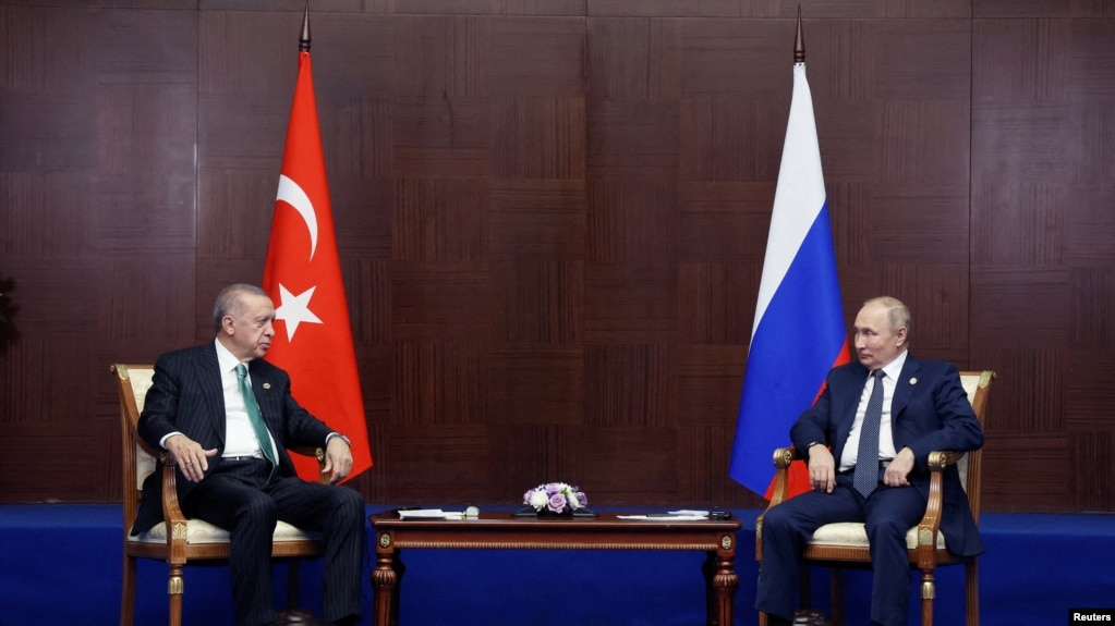 FILE PHOTO: Russia's President Vladimir Putin and Turkey's President Erdogan meet on the sidelines CICA summit in Astana