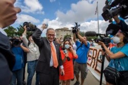 Senate Majority Leader Chuck Schumer of New York, center, celebrates with Deferred Action for Childhood Arrivals recipients and supporters in front of the Supreme Court, June 18, 2020, in Washington.
