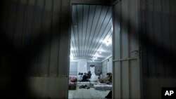 Muslim pilgrims sit inside their accommodation after their arrival at Arafat during the first day of the annual hajj pilgrimage, near the holy city of Mecca, Saudi Arabia, Sept. 10, 2016.