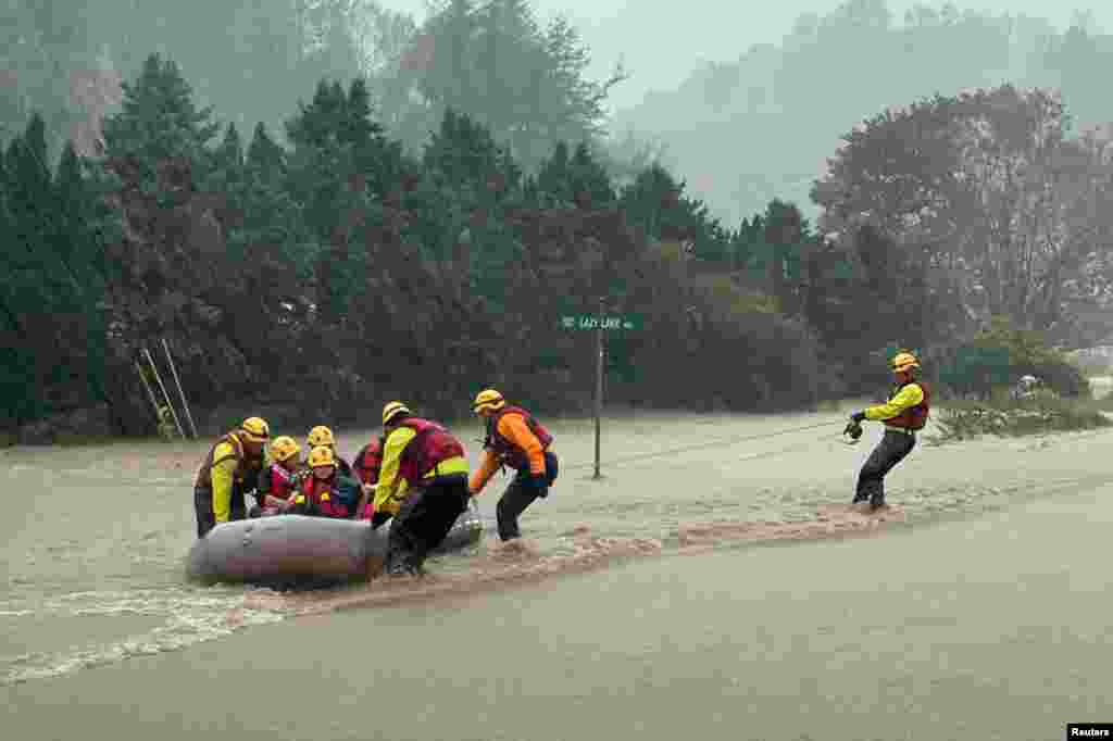 A swift water team rescues residents from severe flooding as Tropical Storm Helene strikes, in Boone, North Carolina.