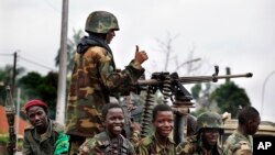 Seleka soldiers sit in a pick-up truck in Bangui, Central African Republic, Dec. 6, 2013.