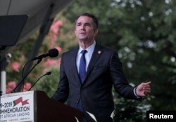 Virginia's Gov. Ralph Northam speaks at the 2019 African Landing Commemorative Ceremony, observing the 400-year anniversary of the arrival of the first enslaved Africans in Virginia, in Hampton, Va., Aug. 24, 2019.