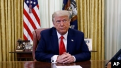 President Donald Trump participates in a law enforcement briefing on the MS-13 gang in the Oval Office of the White House, Wednesday, July 15, 2020, in Washington. (AP Photo/Patrick Semansky)
