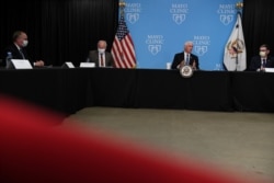 Vice President Mike Pence, 2nd right, hosts a roundtable meeting as he tours Mayo Clinic facilities supporting coronavirus disease (COVID-19) research and treatment, in Rochester, Minnesota, April 28, 2020.