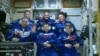 Canadian Space Agency astronaut David Saint-Jacques waves upon uniting with the rest of the crew members on the International Space Station after its capsule hatch opened upon docking in this still image captured from NASA video in space, Dec. 3, 2018. 