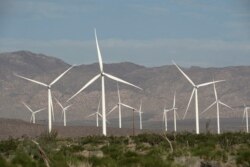 FILE - Power-generating Siemens 2.37 megawatt (MW) wind turbines are seen at the Ocotillo Wind Energy Facility in California, May 29, 2020.