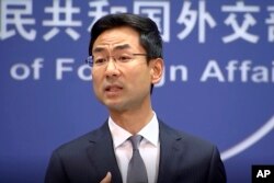 FILE - Chinese Foreign Ministry spokesman Geng Shuang speaks during a media briefing in Beijing in this July 17, 2019, image from video.