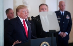 FILE - President Donald Trump delivers a statement on Iran's missile attacks on U.S.-led forces in Iraq, at the White House in Washington, Jan. 8, 2020.