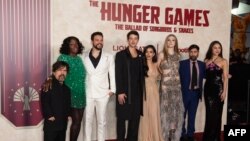 L-R, actor Peter Dinklage, actress Viola Davis, actor Josh Andres Rivera, British actor Tom Blyth, actress Rachel Zegler, actress Hunter Schafer, actor Jason Schwartzman, and singer Olivia Rodrigo attend the premiere of "The Hunger Games: The Ballad of Songbirds & Snakes" 