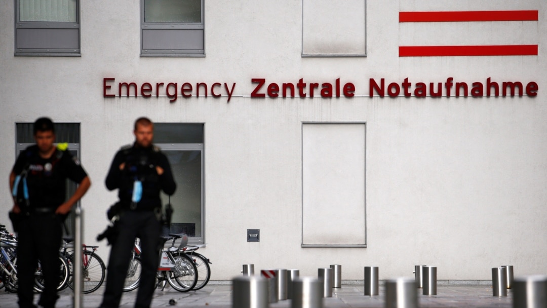 FILE - Police officers stand outside the Charite Mitte Hospital Complex, where Russian opposition leader Alexei Navalny is receiving medical treatment, in Berlin, Germany, Aug. 24, 2020.