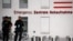 FILE - Police officers stand outside the Charite Mitte Hospital Complex, where Russian opposition leader Alexei Navalny is receiving medical treatment, in Berlin, Germany, Aug. 24, 2020.