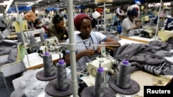 FILE - Kenyan workers prepare clothes for export at a factory in Athi River, near the Kenyan capital, Nairobi, July 31, 2009. 