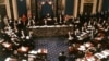 FILE - The proceedings of the US Senate vote in the impeachment trial of President Bill Clinton is pictured in this Feb. 12, 1999 photo.