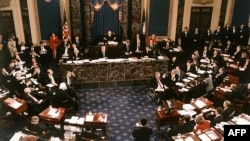 FILE - The proceedings of the US Senate vote in the impeachment trial of President Bill Clinton is pictured in this Feb. 12, 1999 photo.