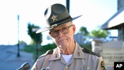 Deputy Gilbert Acciardo, Public information Officer with the Laurel County Sheriff's Office, listens to a reporters question during a press conference on the progress of the investigation of the shooting along I-75 in London, Kentucky, Sept. 8, 2024.