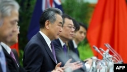 China's Foreign Minister Wang Yi (C) speaks during a bilateral meeting with New Zealand's Minister of Foreign Affairs Winston Peters (not pictured) at Parliament in Wellington on March 18, 2024.