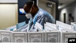 FILE - Biotechnology company Moderna protocol files for COVID-19 vaccinations are kept at the Research Centers of America in Hollywood, Florida, Aug. 13, 2020.