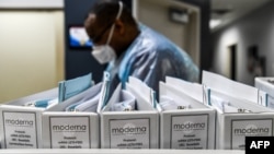 FILE - Biotechnology company Moderna protocol files for COVID-19 vaccinations are kept at the Research Centers of America in Hollywood, Florida, Aug. 13, 2020.