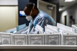 FILE - Biotechnology company Moderna protocol files for COVID-19 vaccinations are kept at the Research Centers of America in Hollywood, Florida, Aug. 13, 2020.