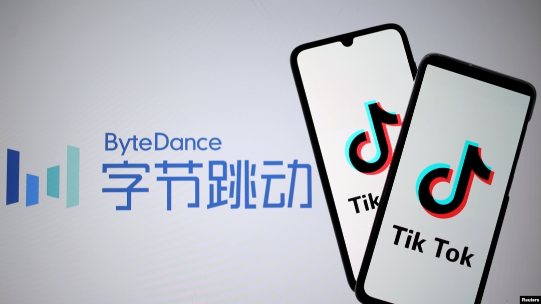 FILE - Tik Tok logos are seen on smartphones in front of a displayed ByteDance logo, Nov. 27, 2019. 