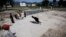 Pakistani boys play at the demolished compound of Osama bin Laden, in Abbottabad, Pakistan, May 2, 2012. 
