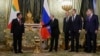 Russian President Vladimir Putin, second left, welcomes Myanmar's junta leader Senior Gen. Min Aung Hlaing, left, during their meeting at the Grand Kremlin Palace in Moscow, March 4, 2025.