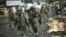 FILE - In this Nov. 30, 2012 file photo, M23 rebels withdraw from the Masisi and Sake areas in the eastern Congo town of Sake, some 27 kms west of Goma, Congo. 