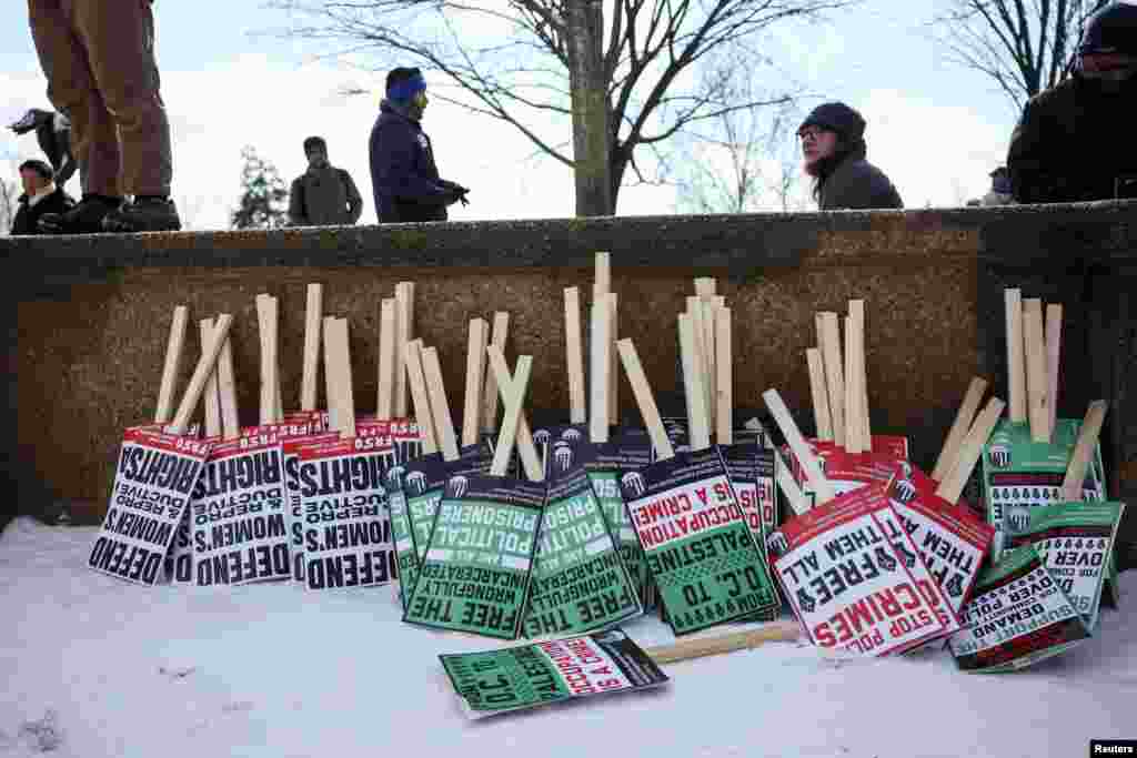 Placards lean against a wall as people gather for a protest held on the day of the inauguration of U.S. President-elect Donald Trump, in Washington, Jan. 20, 2025.