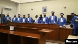 Congolese Judges of the Constitutional Court stand to leave after addressing the court session where they confirmed Felix Tshisekedi's victory in the presidential election in Kinshasa, Democratic Republic of Congo, Jan. 20, 2019. 