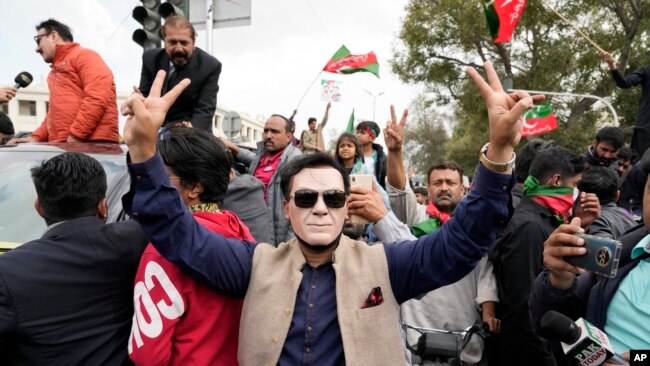 Supporters of former Pakistani Prime Minister Imran Khan chant slogans during a protest against the Pakistan Election Commission in Lahore, Pakistan, on March 2, 2024.