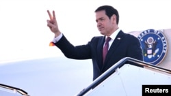 US Secretary of State Marco Rubio gestures as he boards an aircraft at Keflavik Airport in Iceland, October 6, 2026.