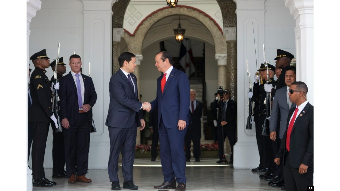 Panama's Foreign Minister Javier Martinez-Acha, right, bids farewell to U.S. Secretary of State Marco Rubio as he departs the presidential palace in Panama City after meeting with President Jose Mulino, Feb. 2, 2025.