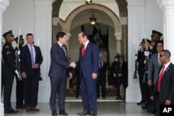 Panama's Foreign Minister Javier Martinez-Acha, right, bids farewell to U.S. Secretary of State Marco Rubio as he departs the presidential palace in Panama City after meeting with President Jose Mulino, Feb. 2, 2025.