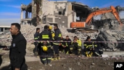 Emergency services clear the rubble of the house of Peshraw Dizayi that was hit in Iranian missile strikes in Irbil, Iraq, Jan. 16, 2024. Dizayi, a prominent local businessman, was killed in one of the Irbil strikes along with members of his family.