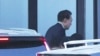 Impeached South Korean President Yoon Suk Yeol arrives at the Corruption Investigation Office for High-ranking Officials in Gwacheon, South Korea, Jan. 15, 2025.