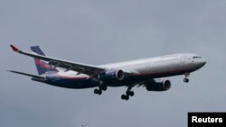 A plane believed to carry Edward Snowden, the former contractor for the U.S. National Security Agency, lands in Moscow's Sheremetyevo airport, June 23, 2013. 