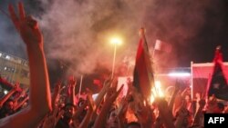 Liviyalılar üsyançıların Yaşıl Meydana daxil olmasını bayram edir